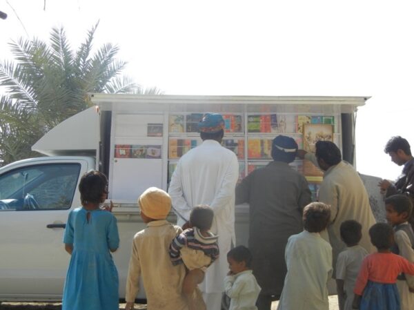 Book van visiting a village