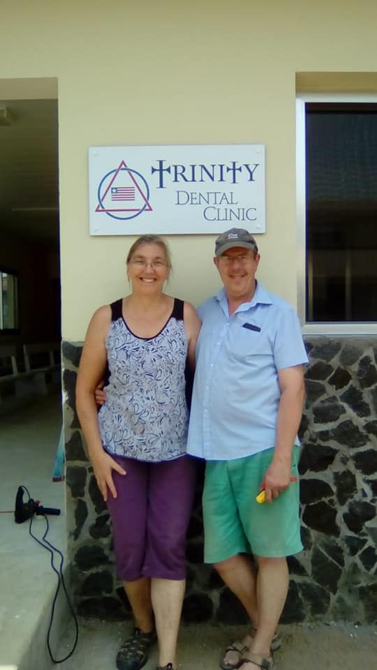 Simon and Grace outside the clinic